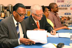 ducation Minister Ronald Thwaites witnesses the contracts for construction and renovation contracts amounting to $103 million to build and upgrade five basic and infant schools in the parishes of Hanover, Westmoreland, St. Elizabeth, Manchester and Kingston. Signing is CEO of the CHASE Fund, Billy Heaven (left). CHASE Directors Dr. Rose Davies (2nd right) and Eugene Kelly were on hand for the contract signing held in the at the Jamaica Pegasus Hotel in Kingston this morning.