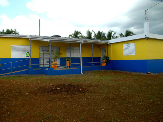 Brightly painted in yellow and royal blue, with three spacious, fully-furnished classrooms; a staff room; sick bay and other amenities for a modern school, the St. Agnes Basic School in Buff Bay, Portland is a stark contrast to the refurbished fowl coop and the one-room, wooden building that served as classrooms for many years.