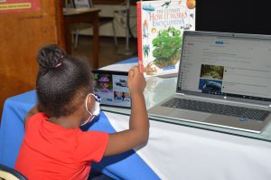 A young student uses the new devices now available at libraries.
