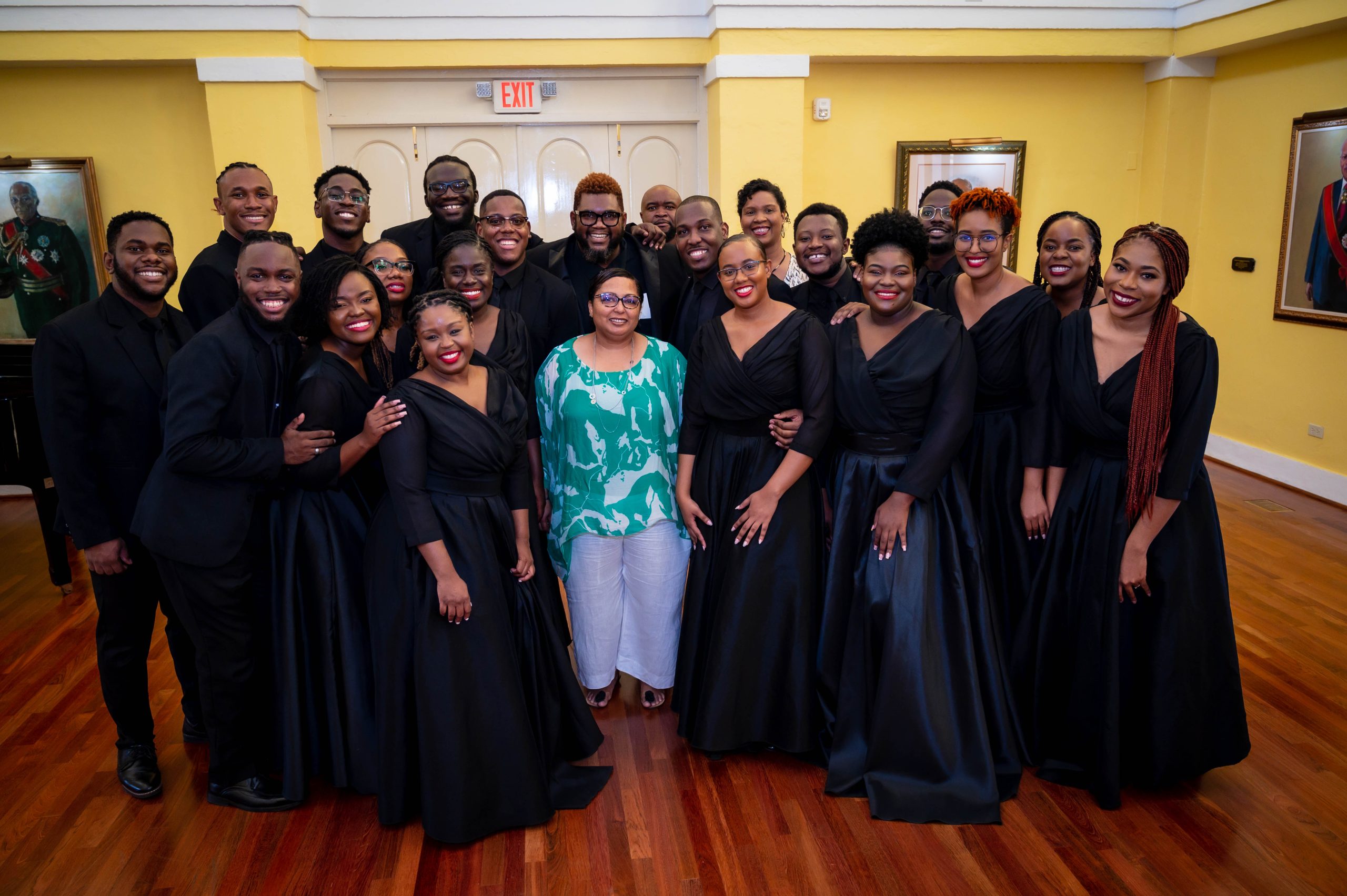 Members of the Jamaica Youth Chorale join CHASE Public Relations and Admin Manager, Hilary Coulton, for a photo at Kings House on January 29, 2023.  